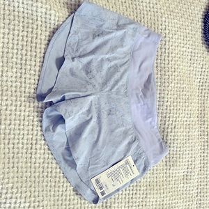 Lululemon Speed Up MR 4” short. Size 8 NWT.  Lilac/purple color.